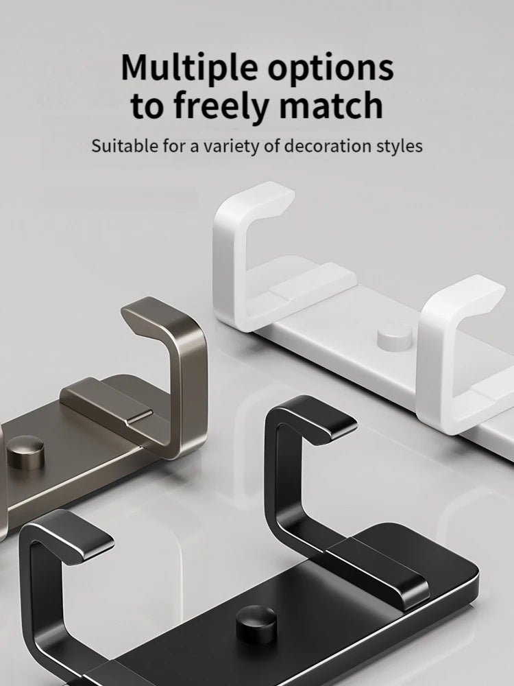 Three wall-mounted hook racks in white, grey, and black color options, shown empty on a white background