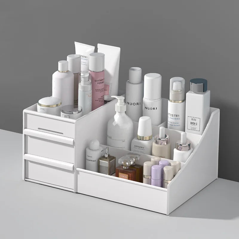 Drawer desktop organizer with skincare, beauty products, and perfumes shown on a tabletop