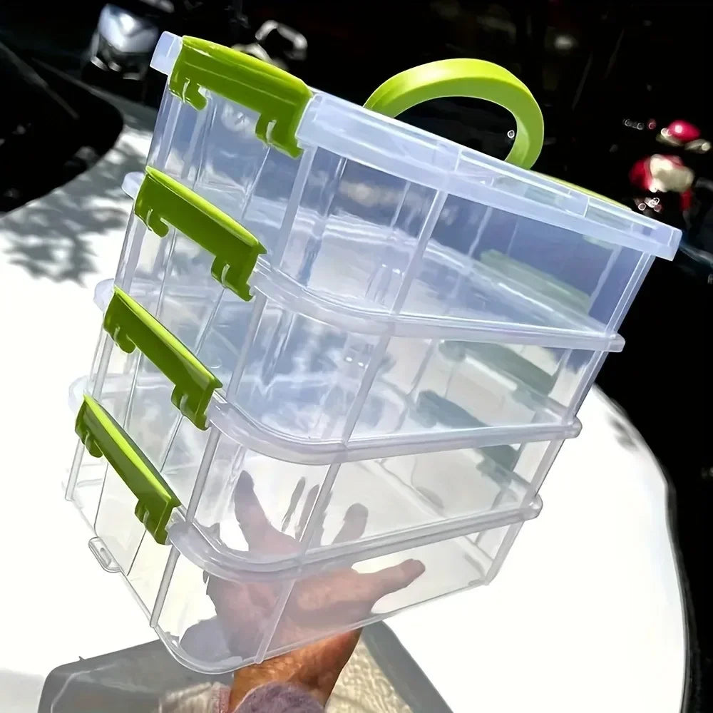 Person holding a stackable clear plastic organizer box with green handle and latches