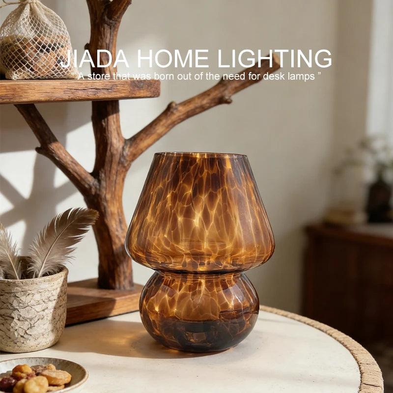 mushroom glass table lamp on a shelf near natural decor in a cozy room