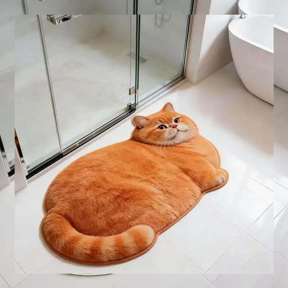 orange cat-shaped bath mat on a bathroom floor next to a glass shower