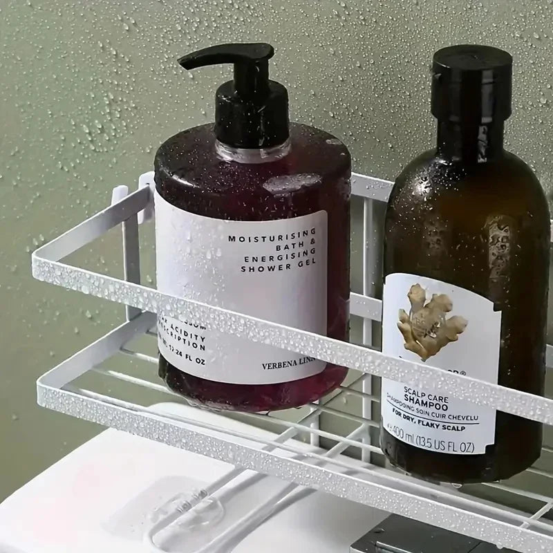 metal bathroom shelf holding shampoo and shower gel in a steamy environment