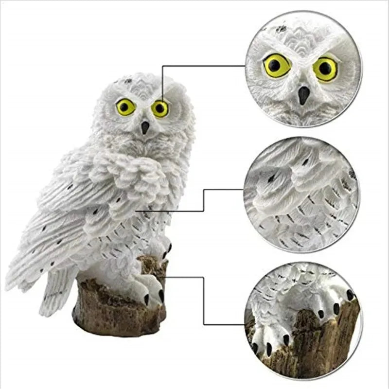 Close-up detail of white owl solar garden light showing feathers, eyes, and claws
