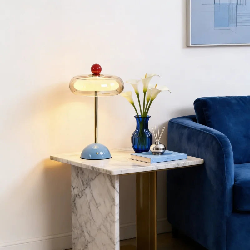 Blue mushroom table lamp on marble side table in living room
