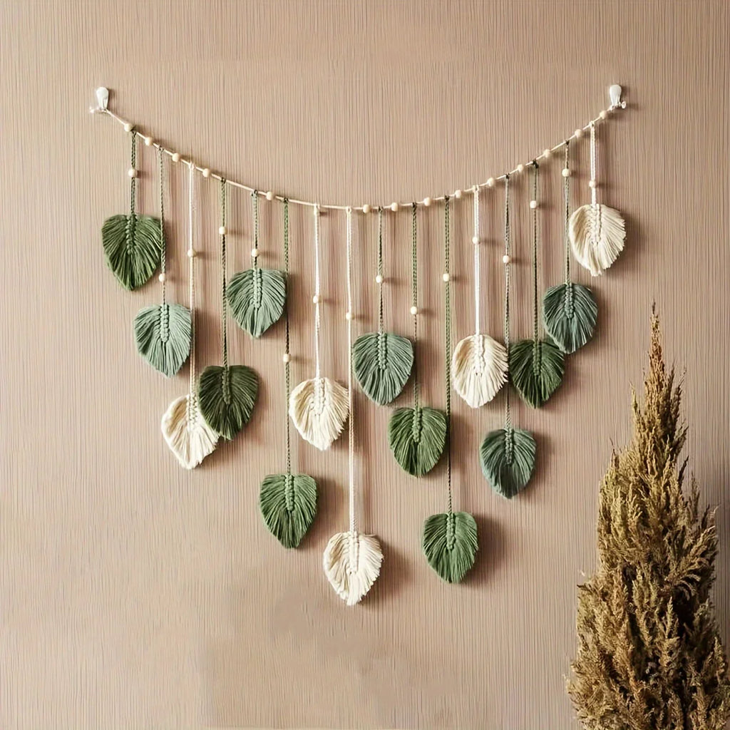 boho green leaf wall hanging in a cozy living room setting