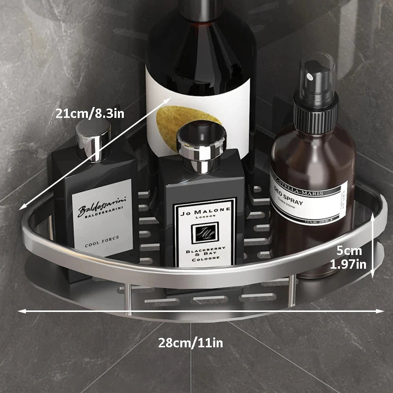 Close-up of silver metal corner shower shelf with labeled dimensions holding shower products