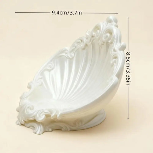 Shell shaped white jewelry tray with embossed details, dimensions 9.4 cm by 8.5 cm shown