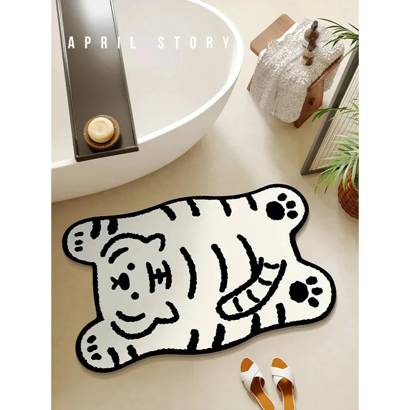 White cartoon tiger animal bath mat beside bathtub in modern bathroom