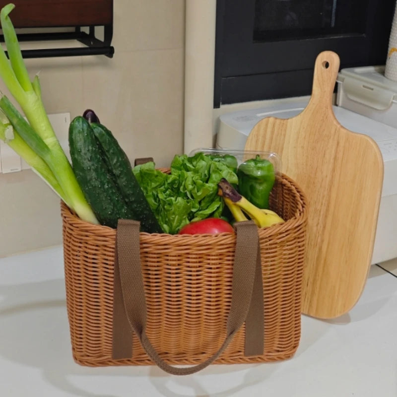 Handwoven storage basket tote on kitchen counter filled with vegetables and fruit