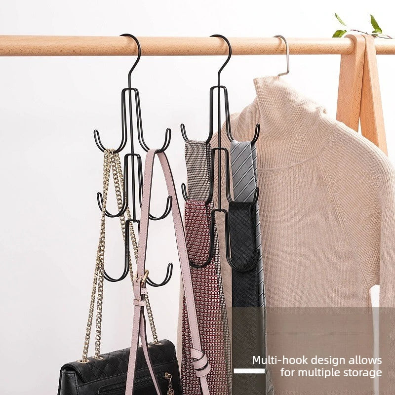 Multi-hook closet organizers hanging on a rod with purses and ties stored neatly