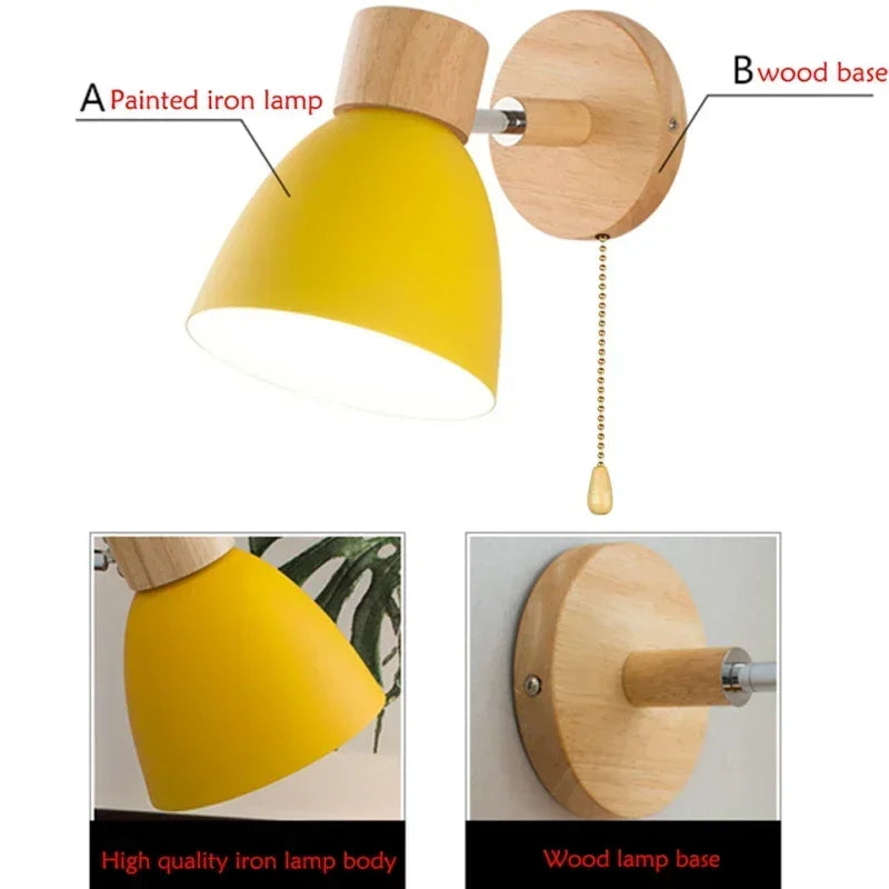 yellow wall sconce with wood base showing painted iron shade details
