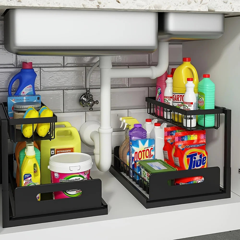 Two black 2-tier sliding organizers under a sink filled with household cleaners