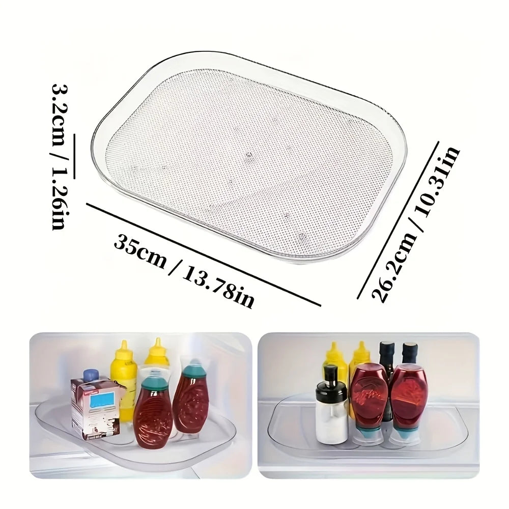 Clear rectangular rotating tray with measurements, pictured holding condiments and bottles