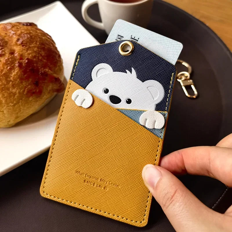 Close-up of a bear animal card holder keychain holding ID card