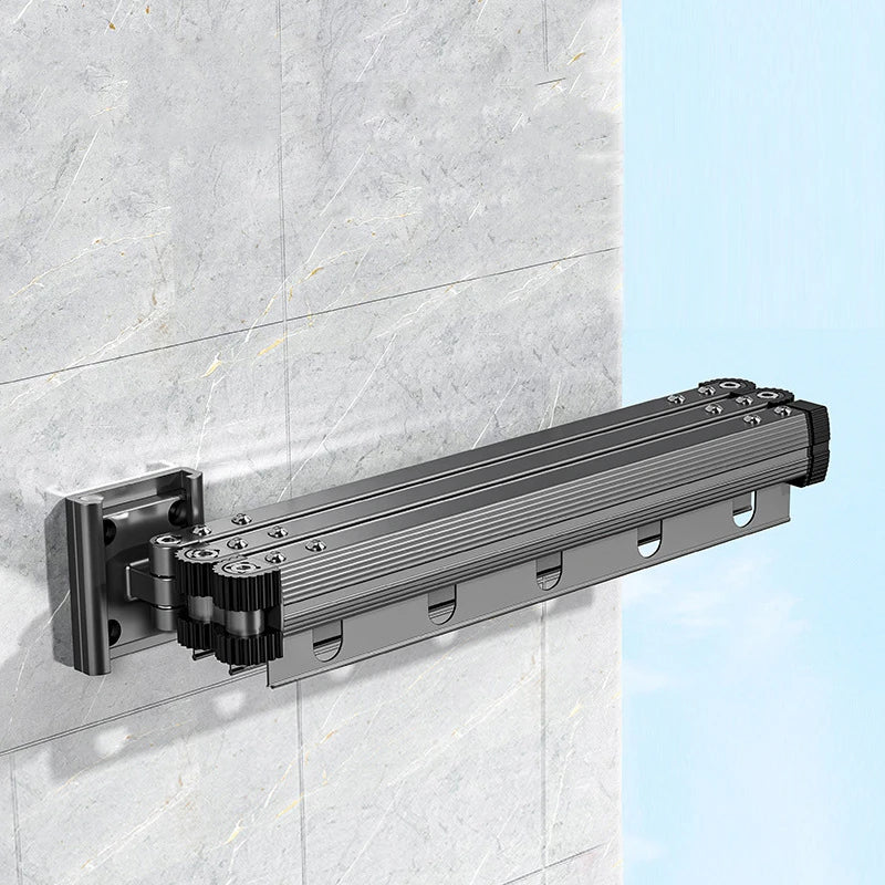 folded aluminum wall-mounted drying rack in gunmetal finish on a tiled wall