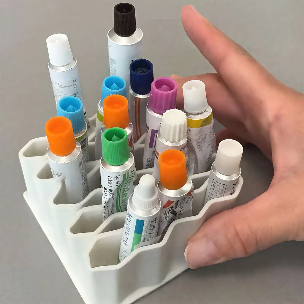 Hand shows scale of the compact silicone organizer filled with tubes