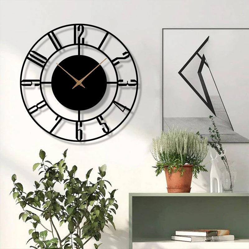 Black open-face wall clock with Arabic numerals above greenery and art in a bright space