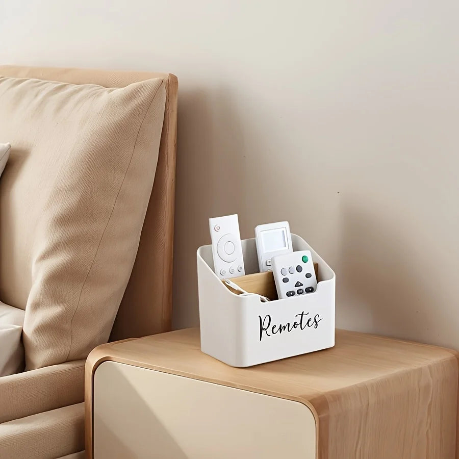 Remote holder caddy on a bedside table next to a beige bed, used to organize remotes