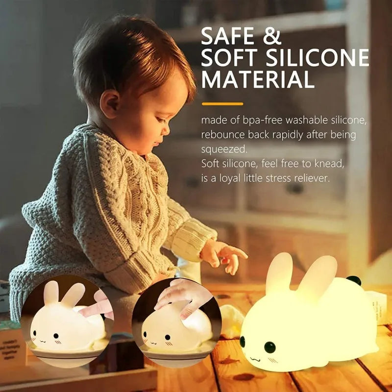 Child sitting by a soft silicone bunny night light in a cozy home setting