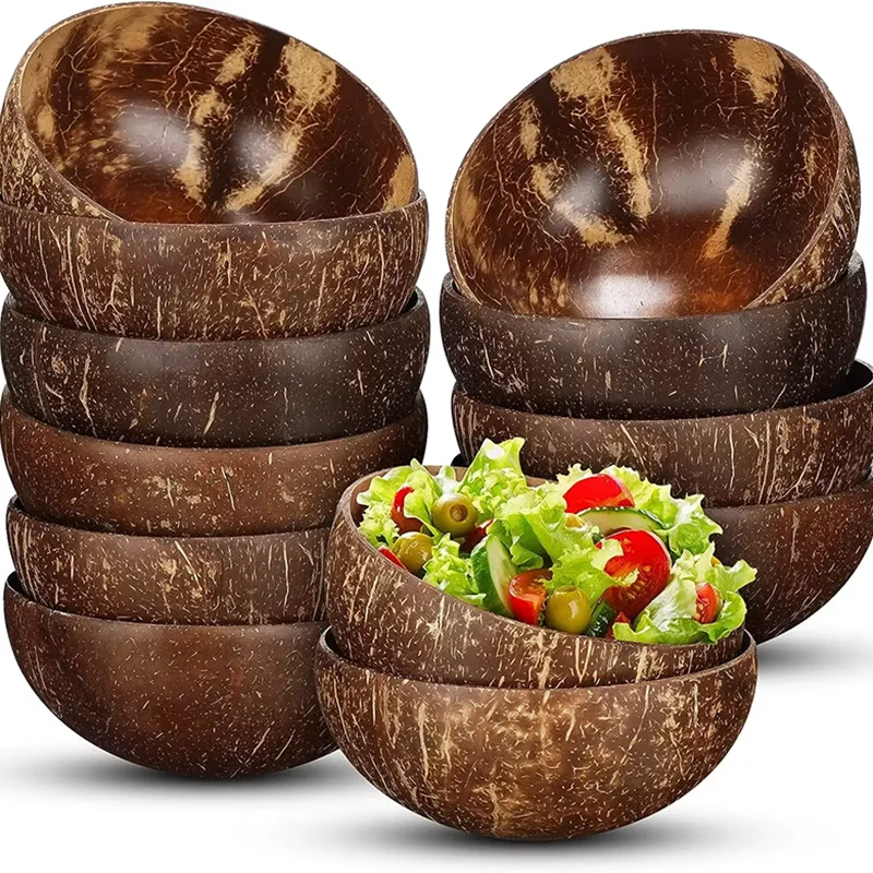 Stacked natural coconut shell bowls with salad inside, grouped on white background