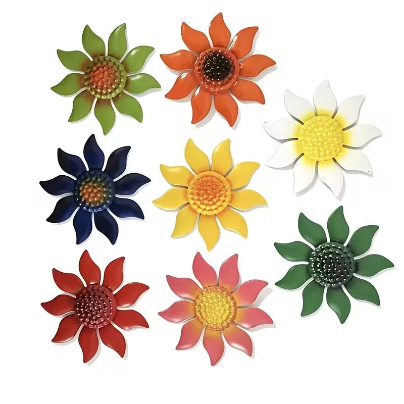 Assortment of eight metal flower wall decorations on white background