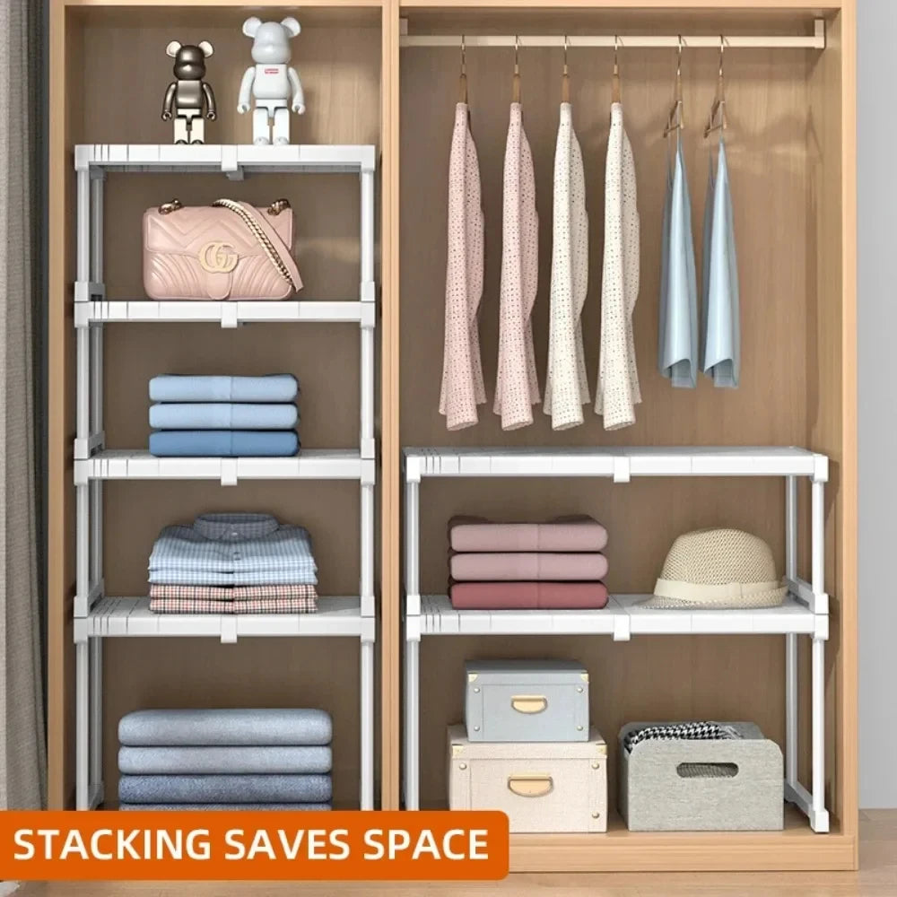 Closet with multiple stackable white shelf dividers organizing folded clothes and accessories