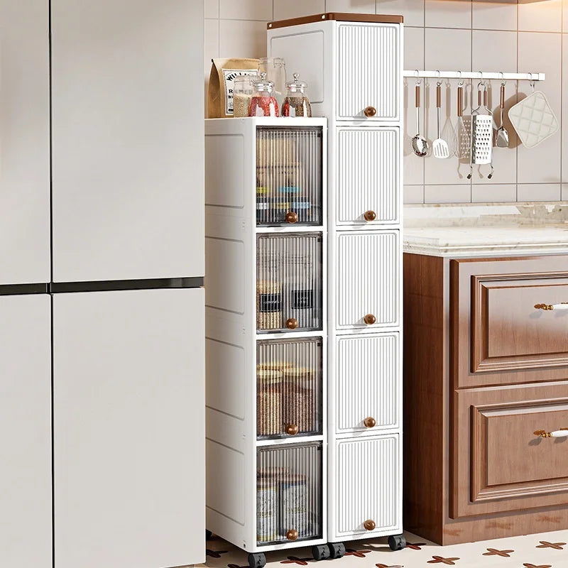 slim door-front rolling cabinet in narrow kitchen space between fridge and counter