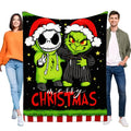 Christmas flannel throw blanket with cheerful graphic holiday characters, displayed by two people