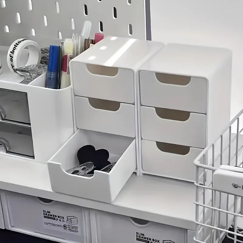 White 3-drawer mini organizer holding small office supplies on a shelf