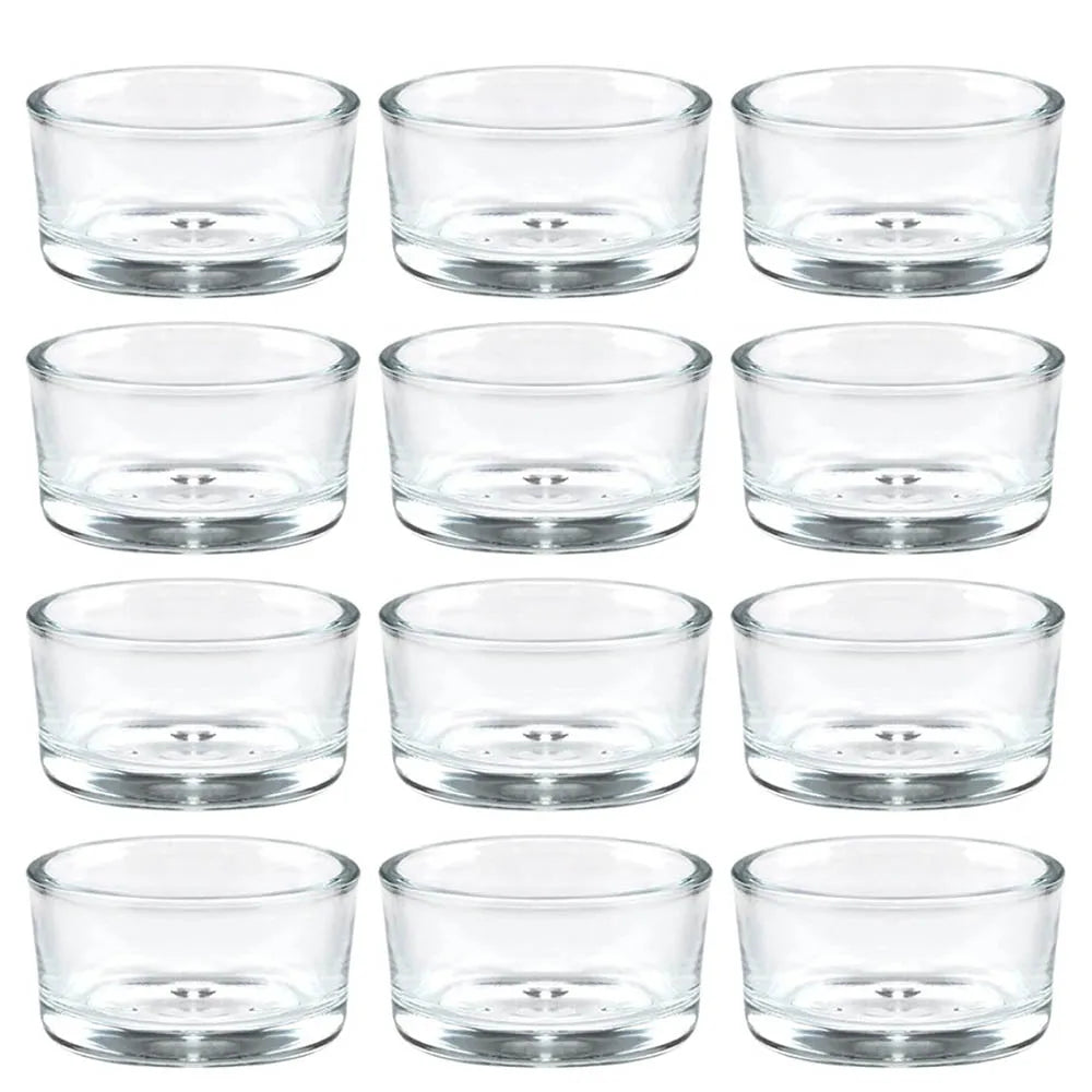 Set of twelve clear glass tealight candle holders arranged in rows