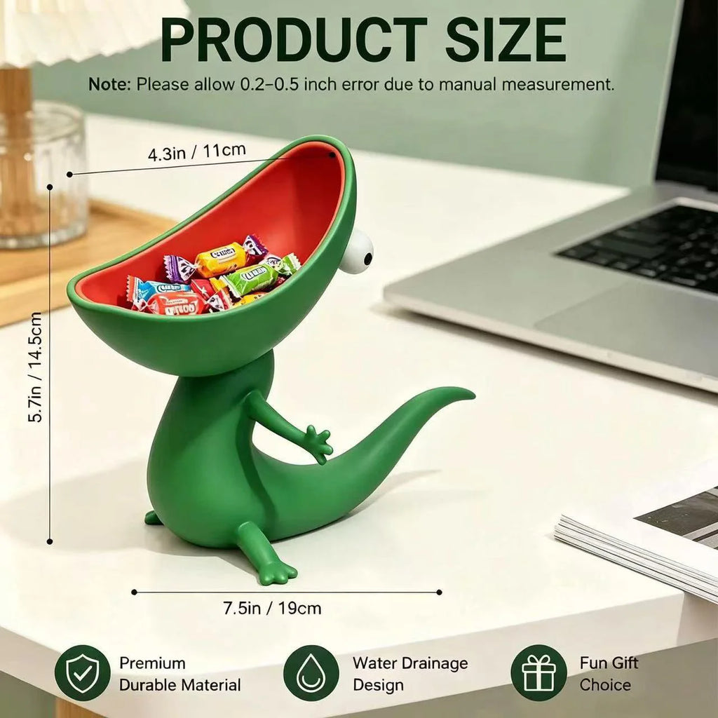 Lizard organizer tray holding wrapped candies on a desk next to a laptop
