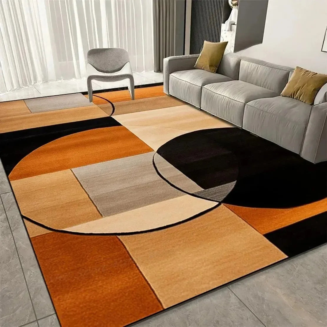 Modern geometric area rug in orange, beige, and black blocks beneath a sofa in a living room