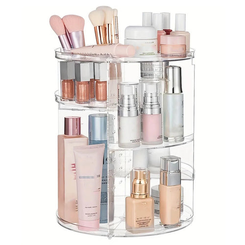 clear rotating makeup organizer filled with beauty products on bathroom counter