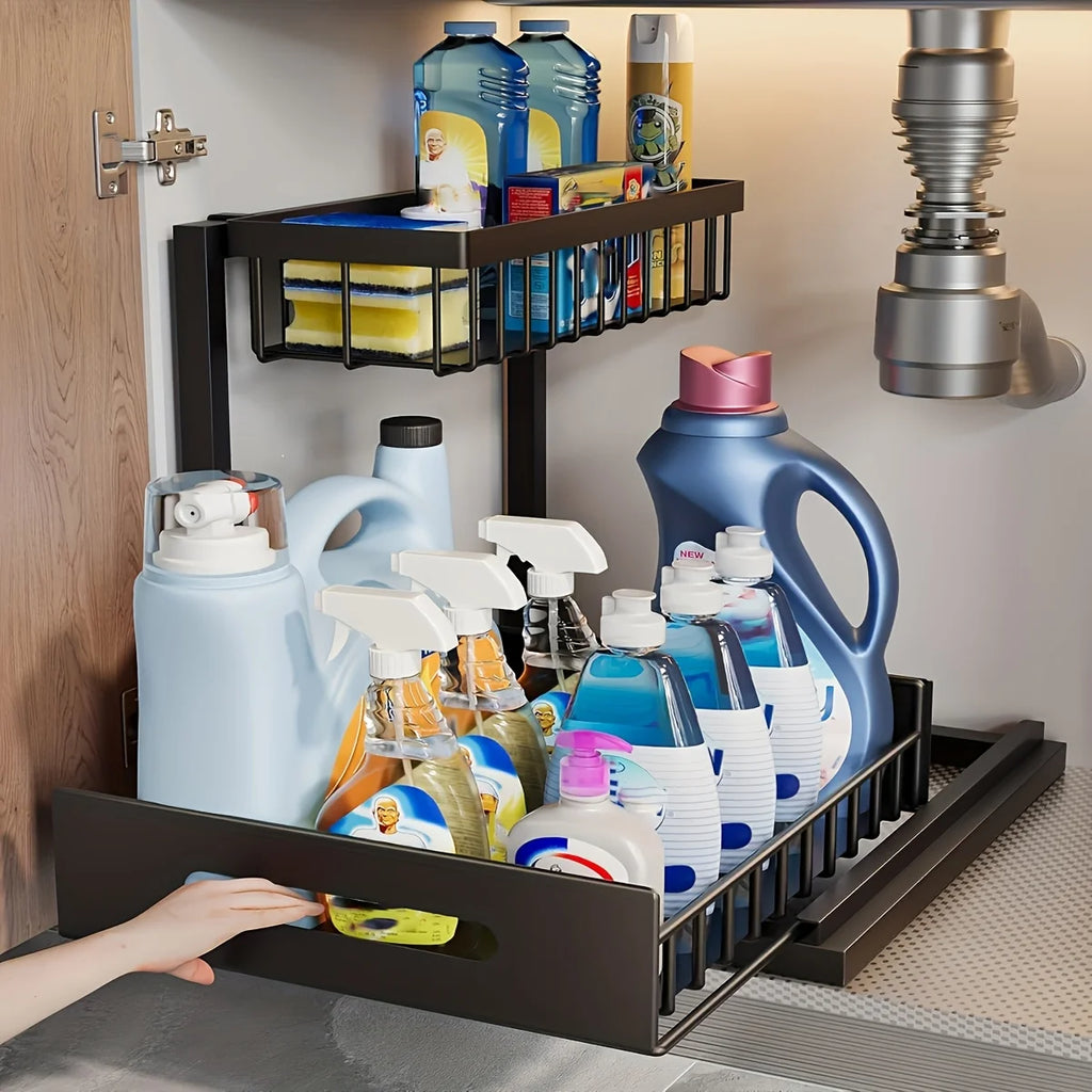 Steel under sink sliding drawer organizer in black, installed in kitchen cabinet and holding cleaning supplies