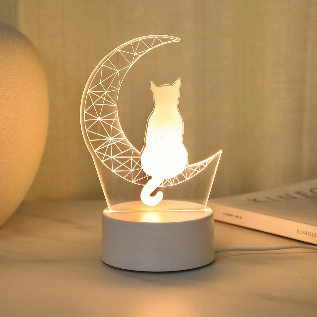3D moon cat bedside night light softly illuminated on a nightstand