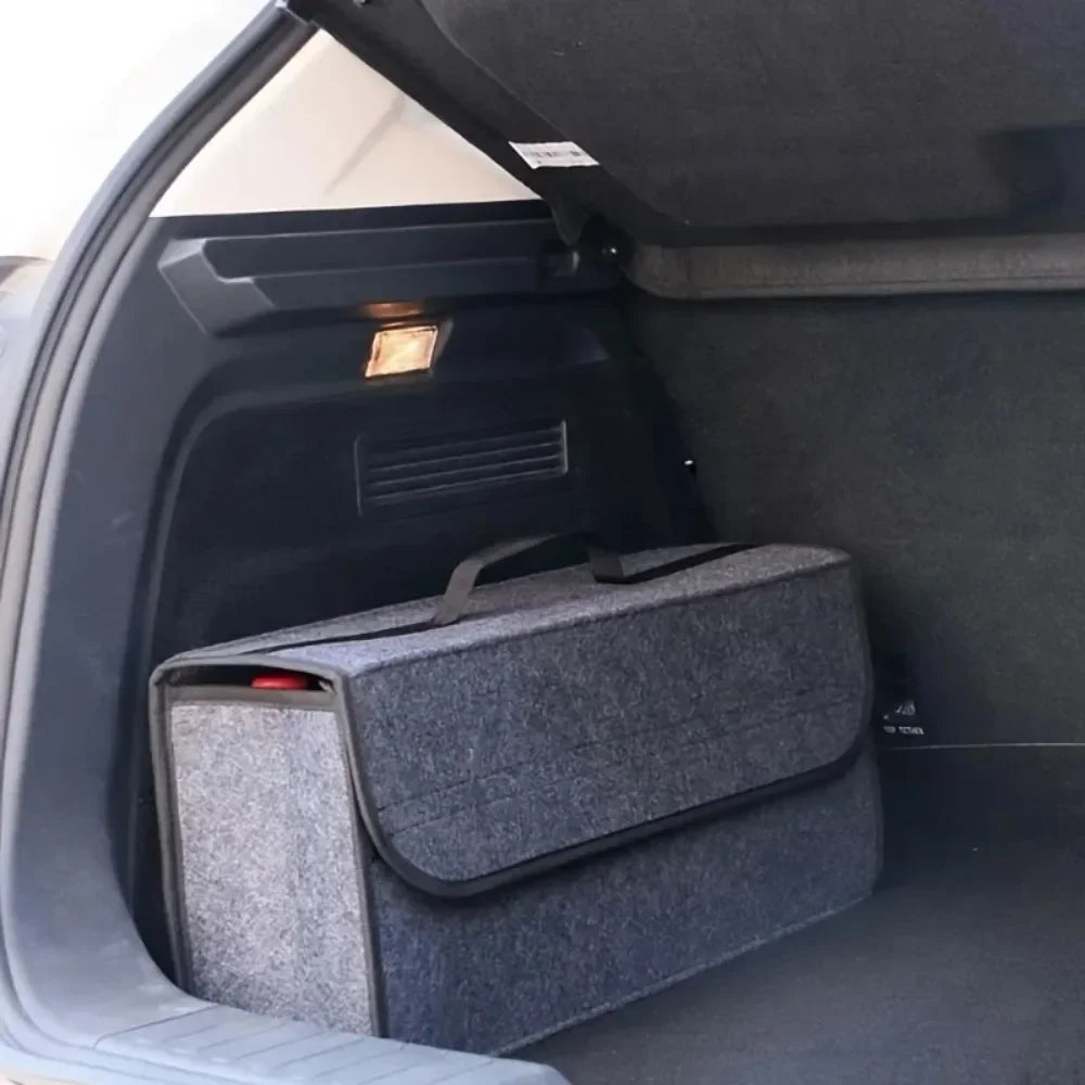Gray felt trunk organizer bag positioned in vehicle trunk