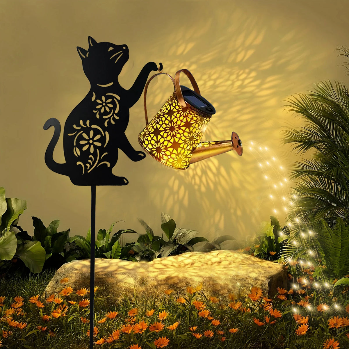 Cat silhouette solar garden lantern with patterned watering can and string lights, creating cozy outdoor ambiance