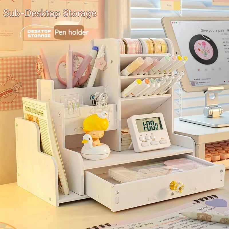 white multi-compartment desk organizer with drawer and various stationery items on a cozy workspace