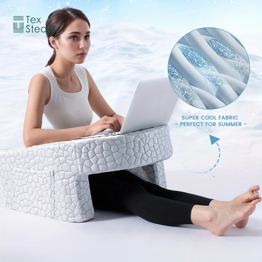 Person using white reading pillow with 'super cool fabric' detail for summer, legs extended on bed