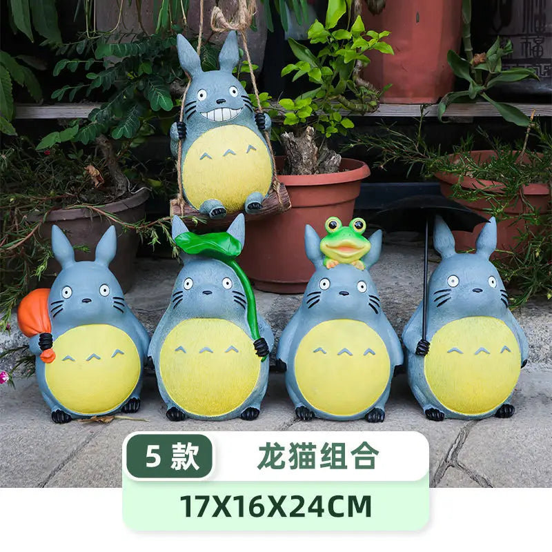 Set of five whimsical resin animal statues with different accessories, arranged beside potted plants, size 17x16x24cm indicated