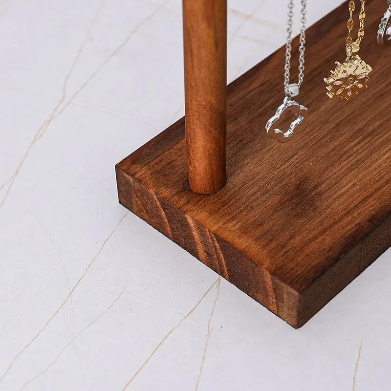 close-up of solid wood base of a jewelry organizer stand
