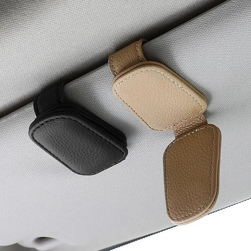 Black and beige PU leather glasses holder clips attached side by side to a car sun visor