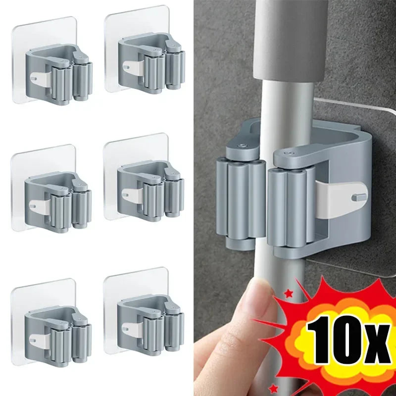 Set of grey self-adhesive mop holders shown on tile and in use on a wall