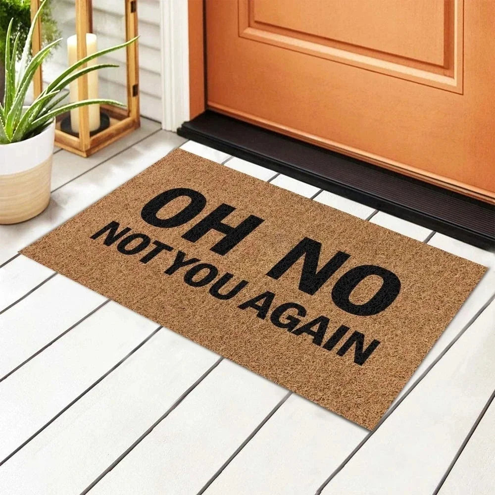 Humorous indoor welcome mat outside a front door on a porch