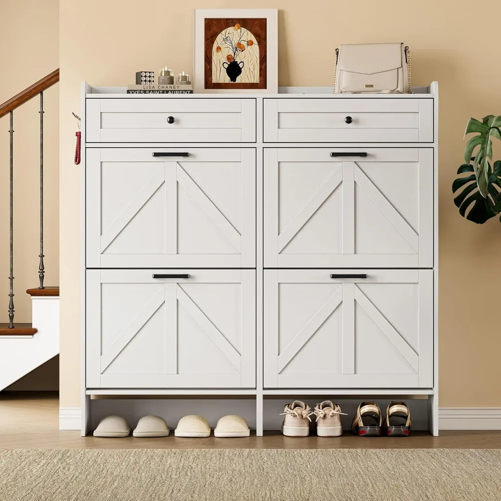 White four-drawer entryway shoe cabinet with top drawers, side hooks, and under-shelf shoe storage in a hallway