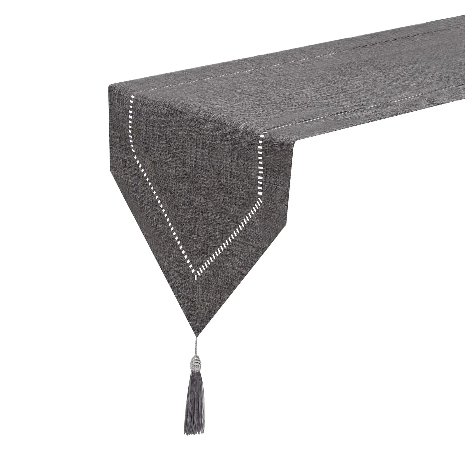 side view of solid gray linen table runner with stitched border and tassel