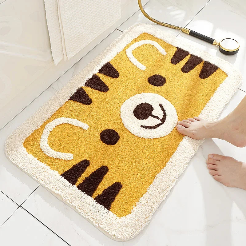 Yellow tiger cartoon animal microfiber bath rug on a white tile bathroom floor