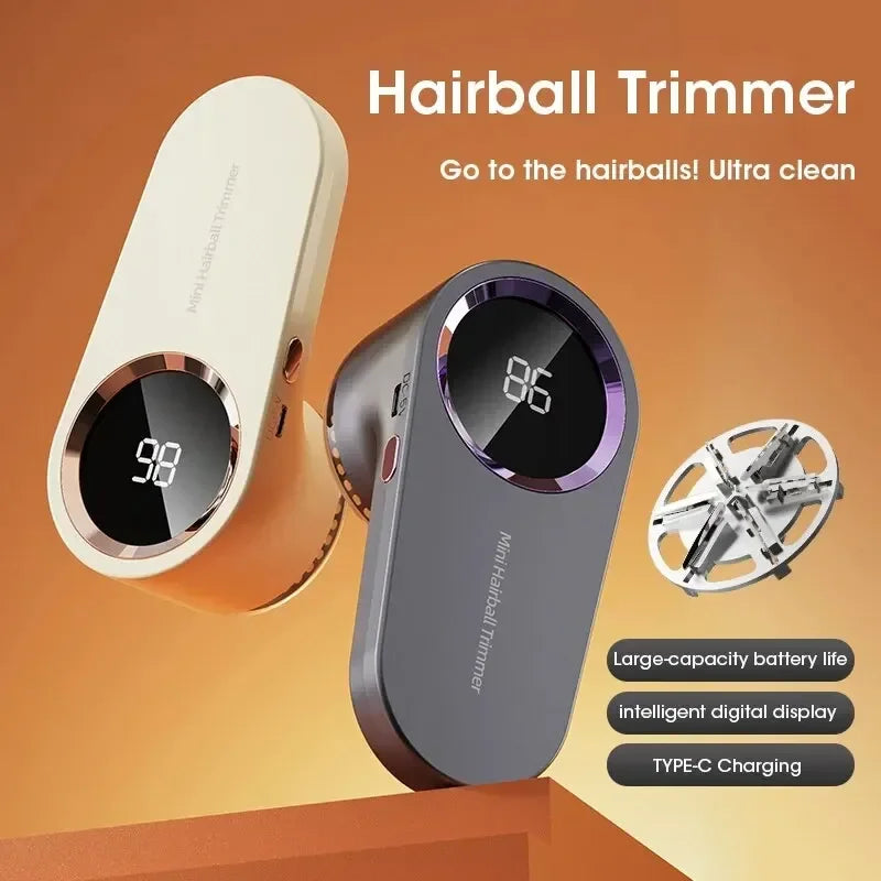 two USB rechargeable fabric lint removers with digital display in grey and white, shown on an orange surface