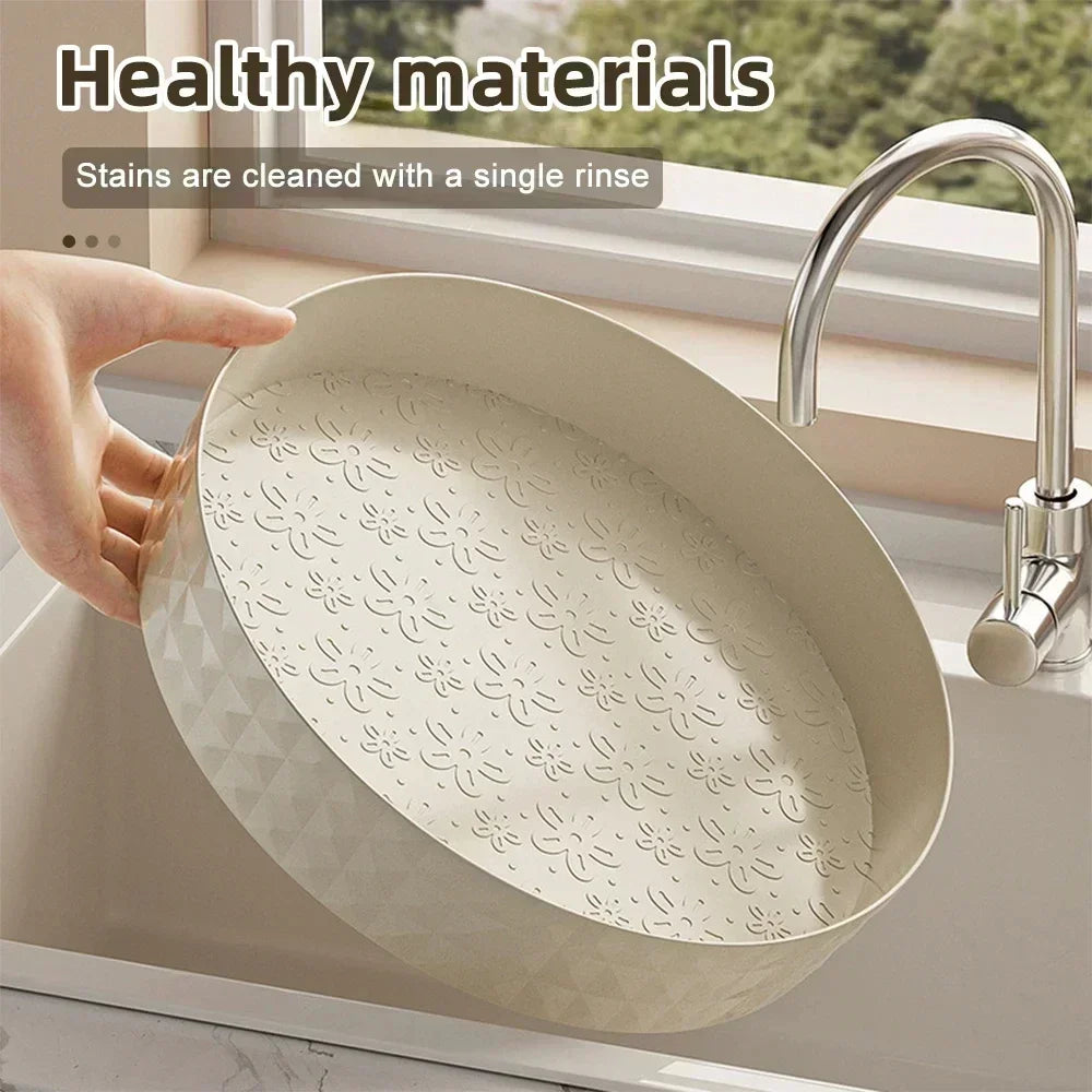 Cream white Lazy Susan organizer held under a running kitchen tap for cleaning