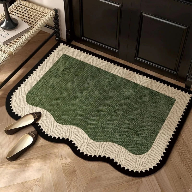Green geometric entry rug in a home foyer by a bench and shoes